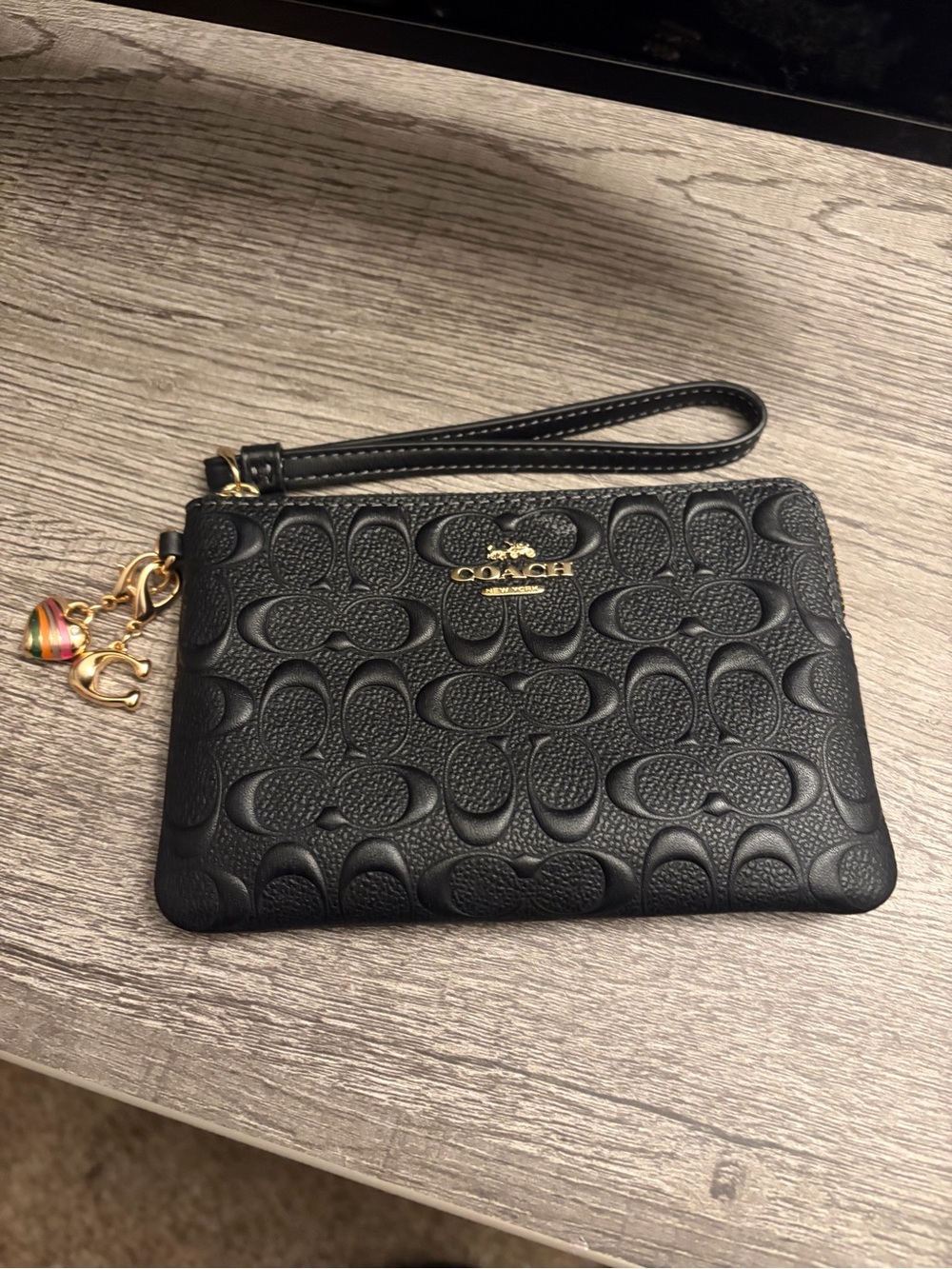 COACH Black Embossed Leather Wristlet with Gold Hardware